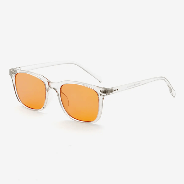 Blåljusglasögon med transparent båge och orange linser i modern fyrkantig design